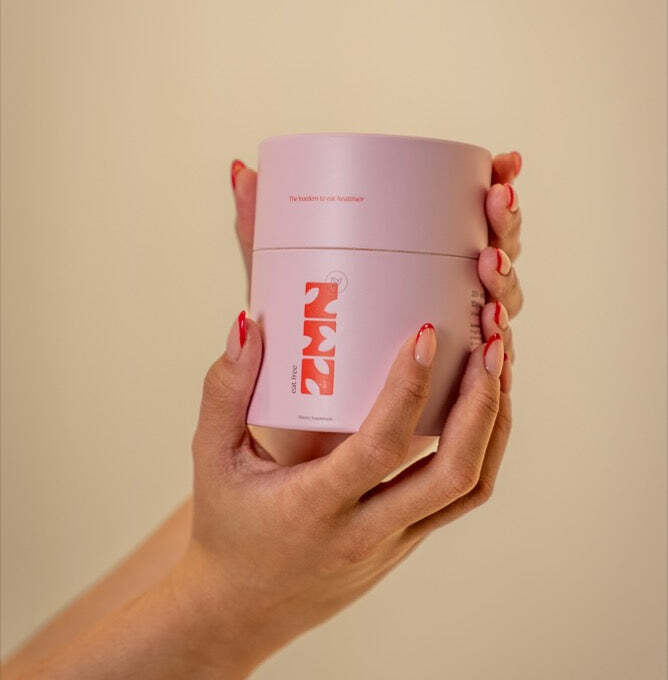 Holding a jar of ZEN Eat Free